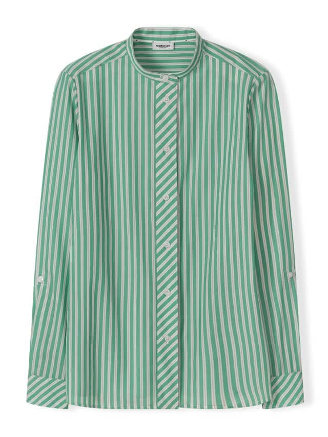 Eine grün‑weiß gestreifte langärmlige Bluse mit Stehkragen und Knopfleiste liegt flach vor weißem Hintergrund.