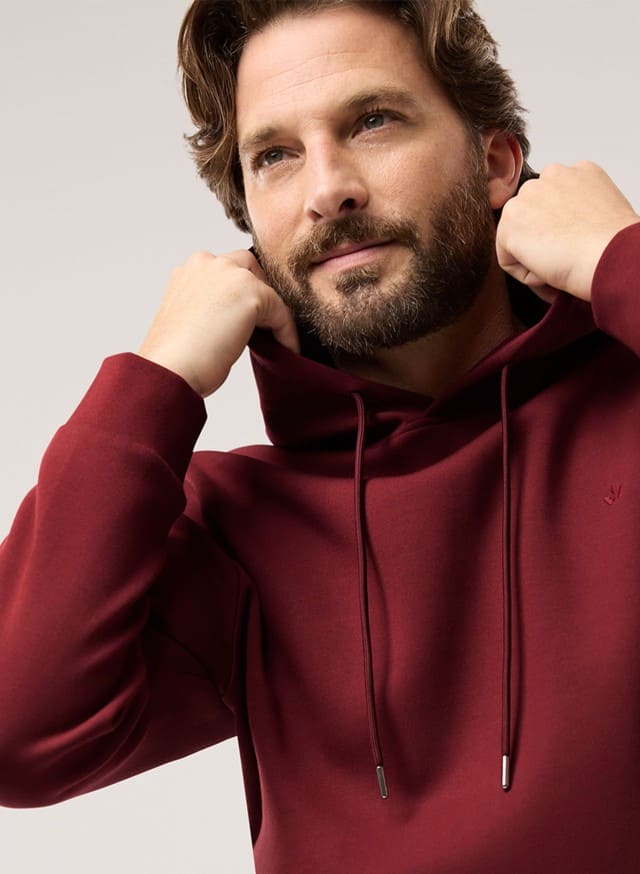 Abbildung Oberkörper Herr in Pullover